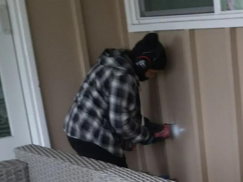 Professional electrician installing an exterior outlet in Little Compton