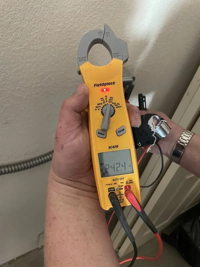 Voltage testing with clamp meter during Outlet Installation in Little Compton